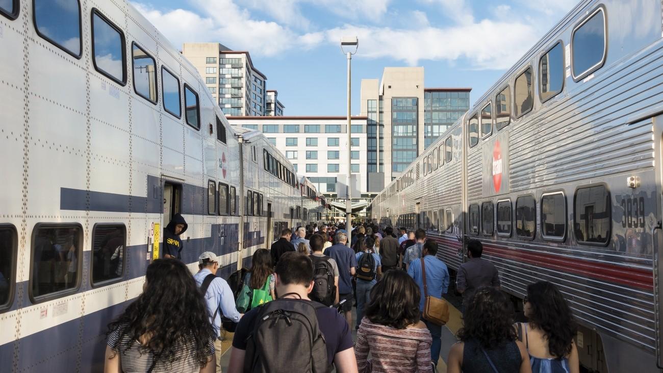 A large crowd of people at the San Francisco Caltrain Station