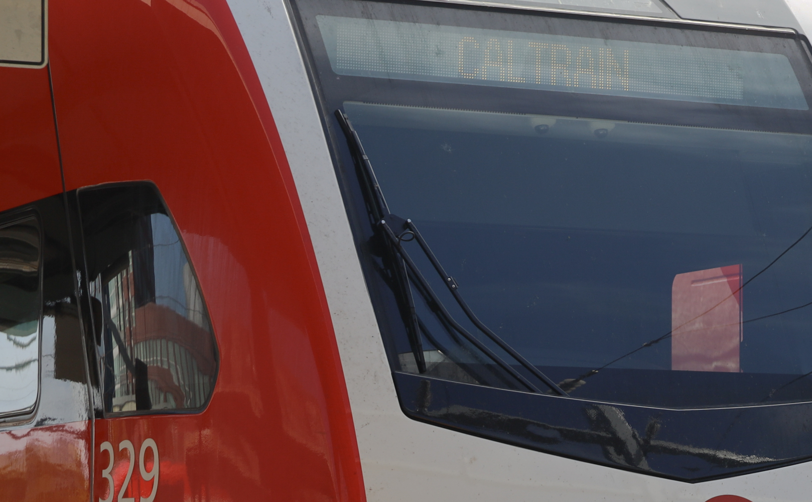 Two Caltrain EMU's side by side on tracks