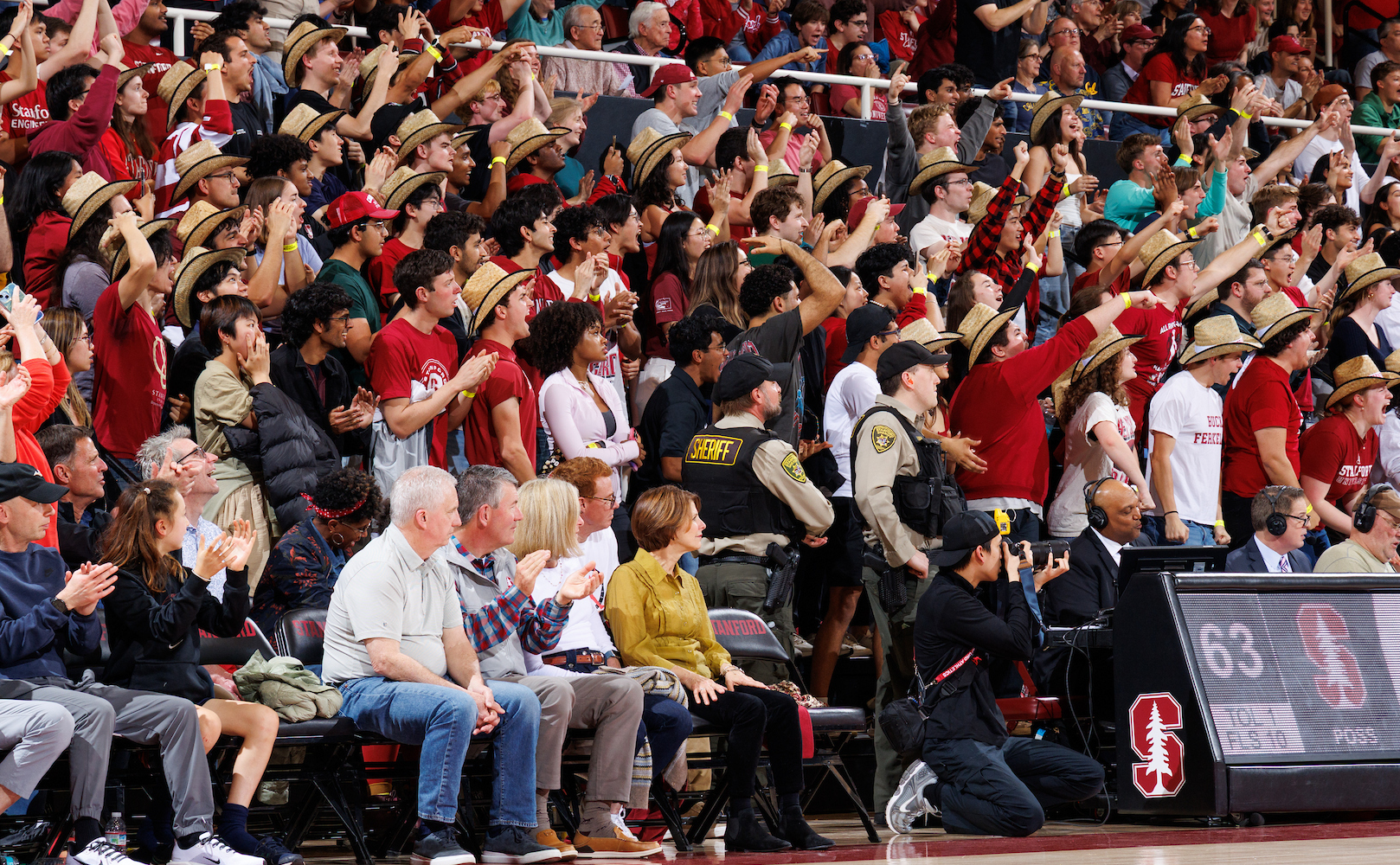 Fans cheering at Maples Pavilion