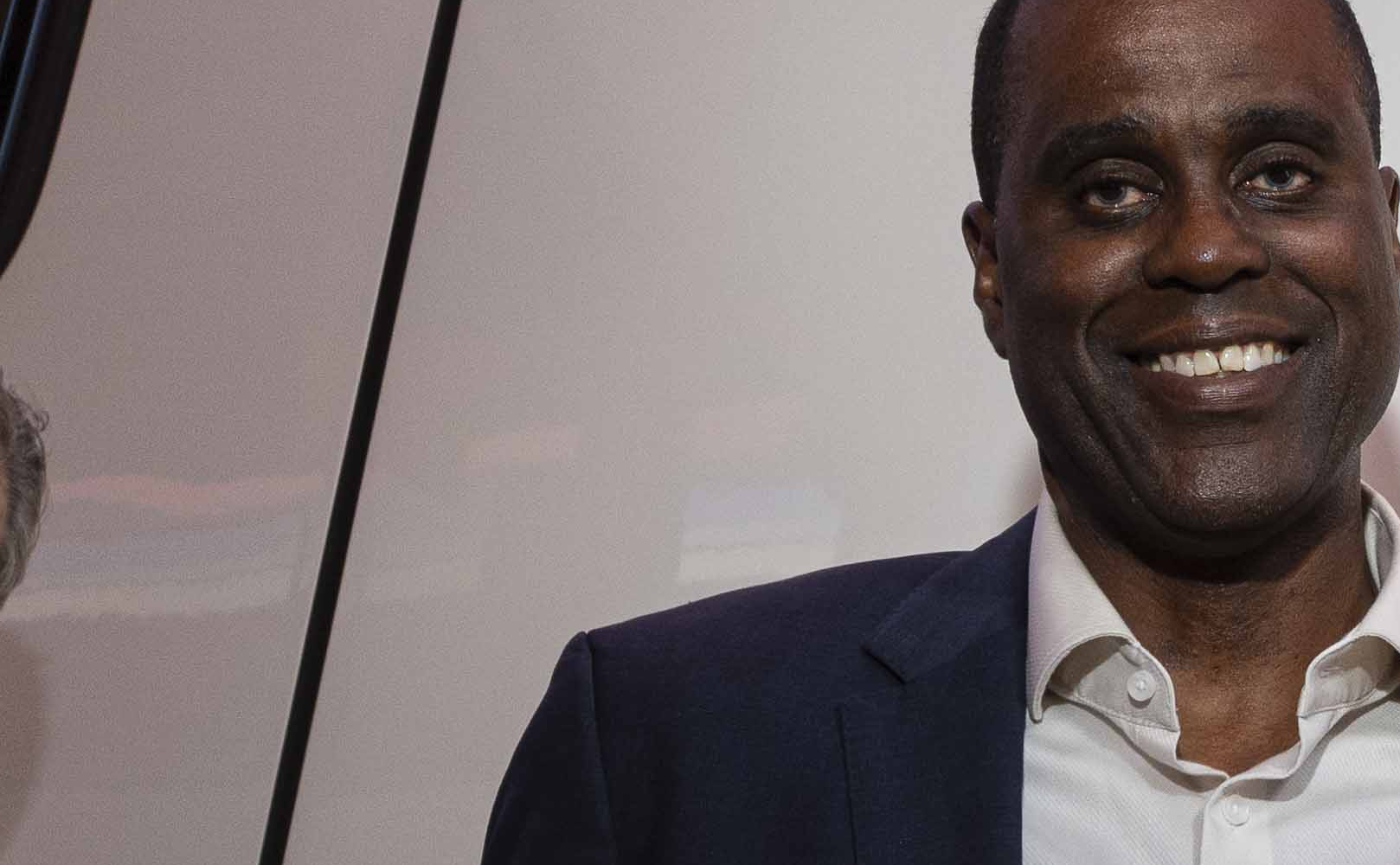 Nancy Pelosi posing in front of train named in her honor