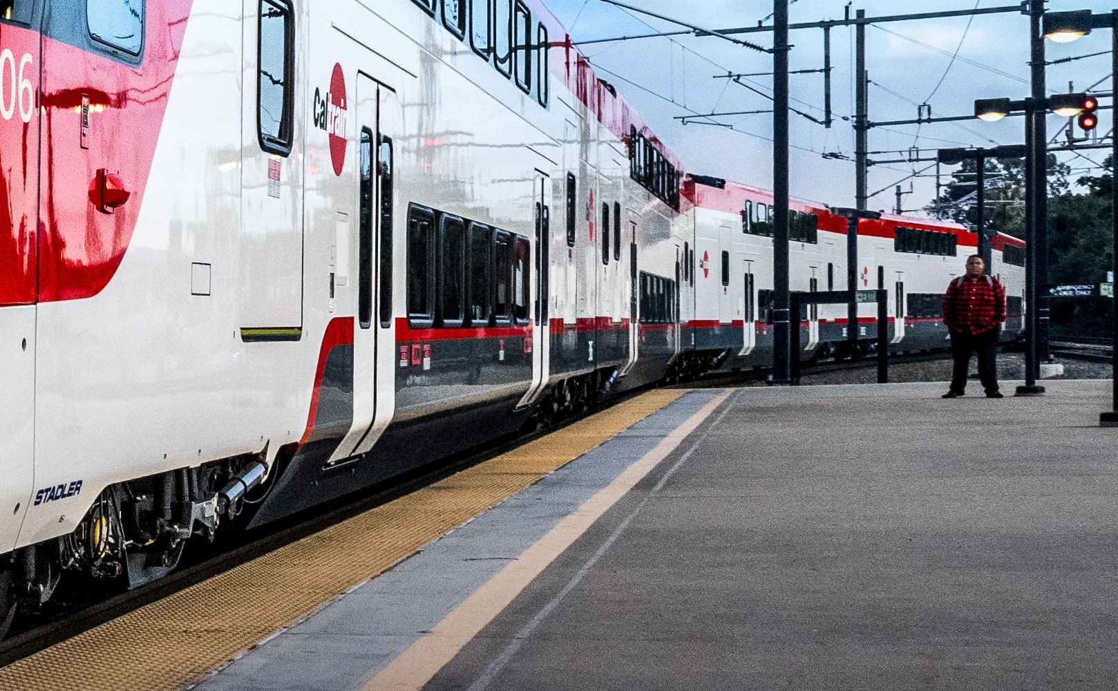 Caltrain train in front of a beautiful blue sky