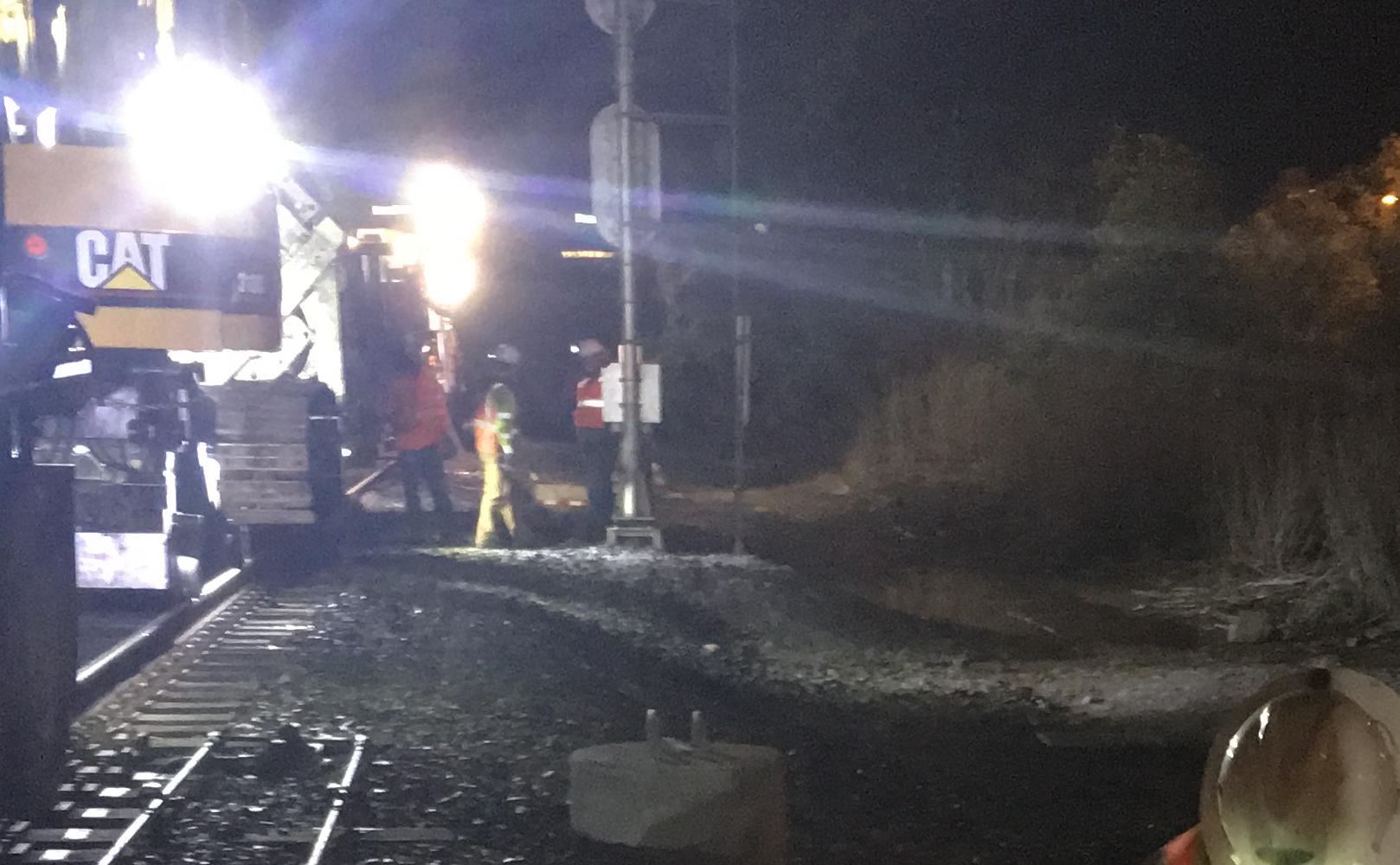 Two worked installing caltrain foundation into ground