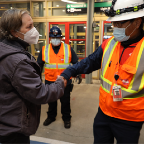 Caltrain Employees Shake Hands