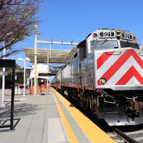 A picture of a big ol' locomotive, sitting at a Caltrain Station