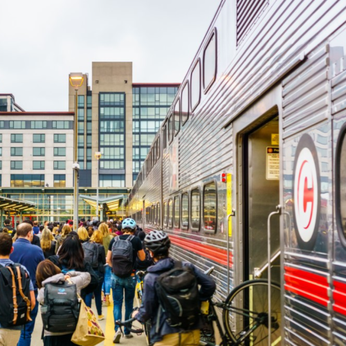 Crowd of people exiting train car