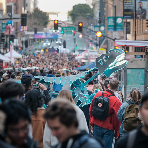 Large crowd for Downtown First Thursday featuring the Doloresaurus