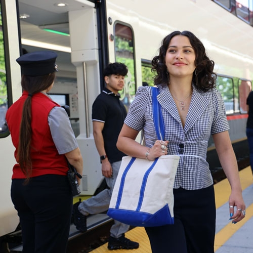 Woman with a totebag disembarking Caltrain