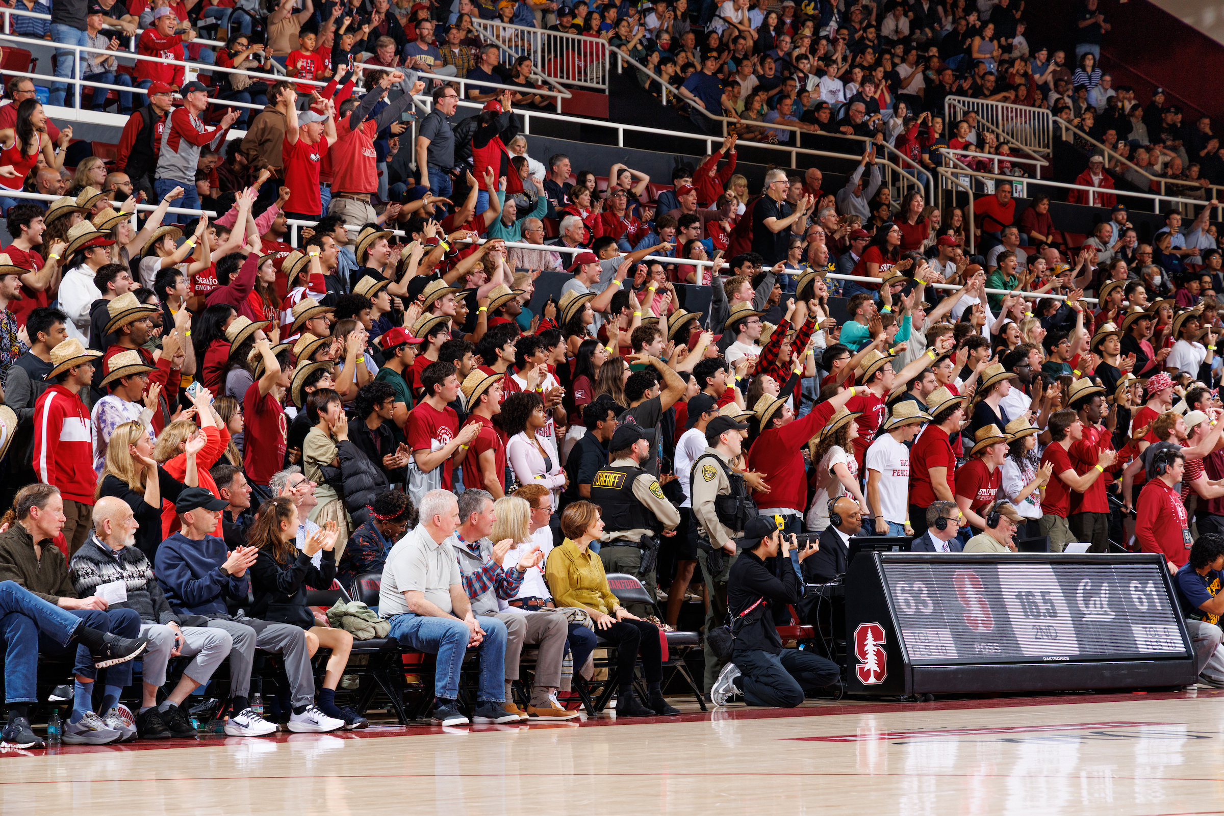 Fans cheering at Maples Pavilion