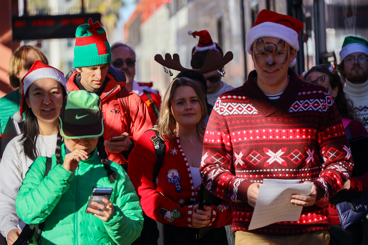 Group of people walking toward Holiday Train